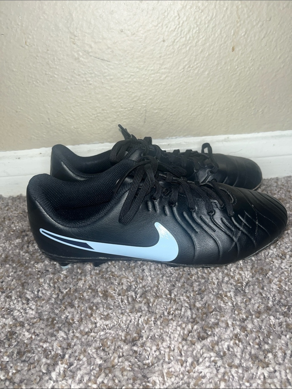 Nike Black Athletic Soccer Cleats with Light Blue Swoosh